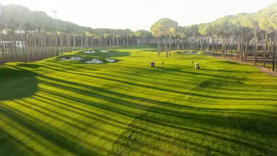 Golf players and buggies on the Regnum Carya golf course in Belek